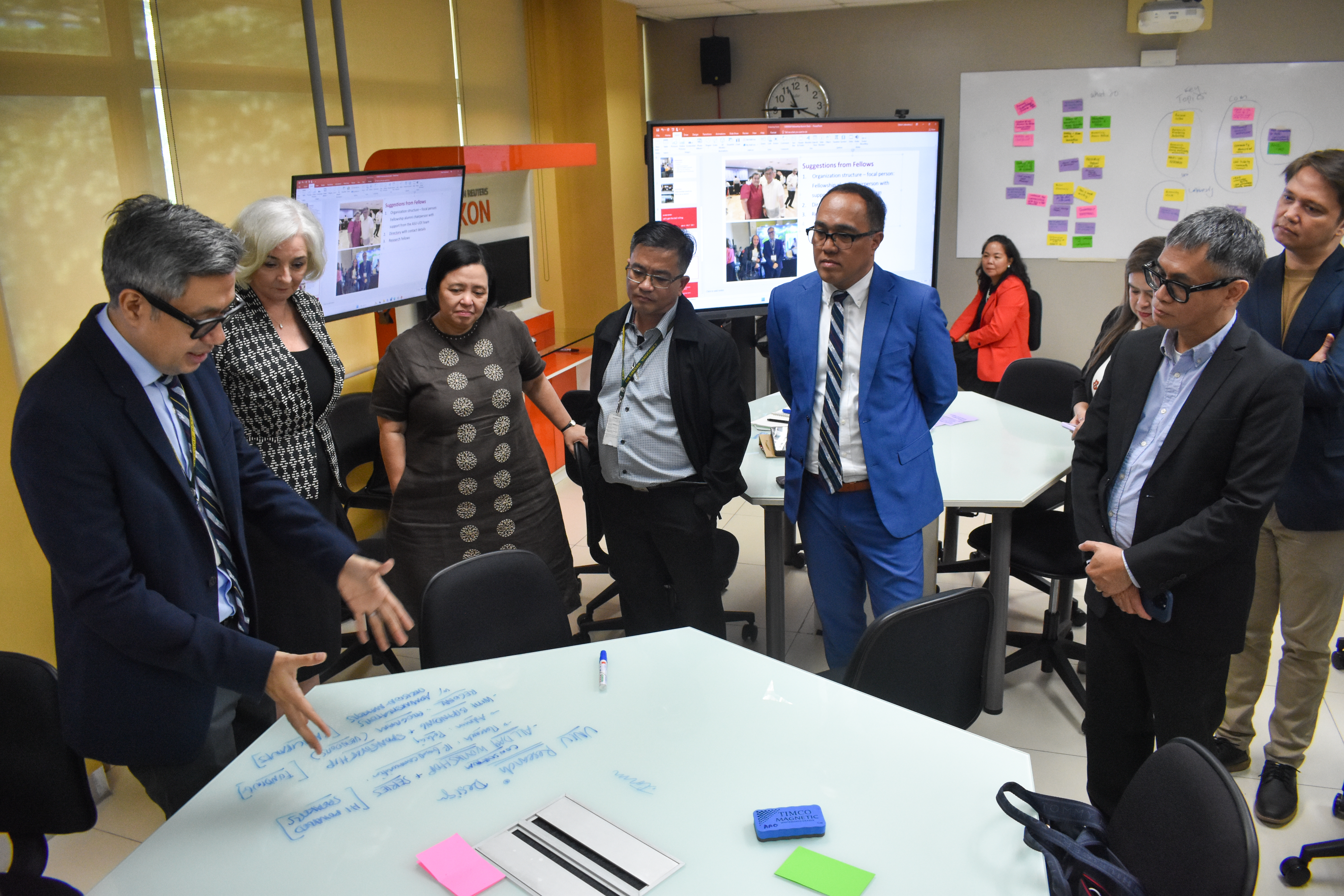 Fellows gather in a room to discuss the future of the program