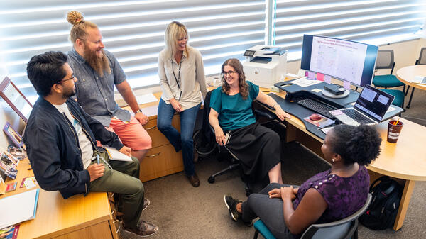 Group of staff, researchers, and leaders coordinating a project.