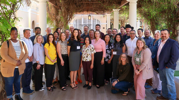 34 faculty and staff gather outside for ASU Leadership Academy graduation