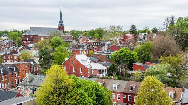 Aerial view of historic downtown Lancaster, Pennsylvania, with blooming trees.